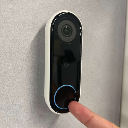 A Google nest doorbell at a front porch thats used to see who is in front of the door